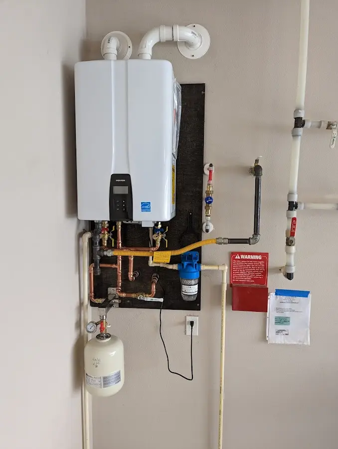 Professional plumber installing copper piping in a Kennedale home